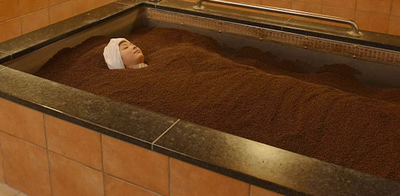 A woman relaxes in a ceramic spa
